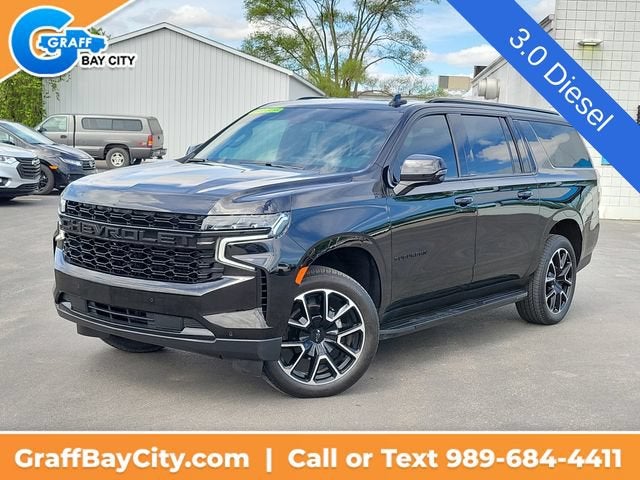 2024 Chevrolet Suburban RST in Black — front three-quarter view
