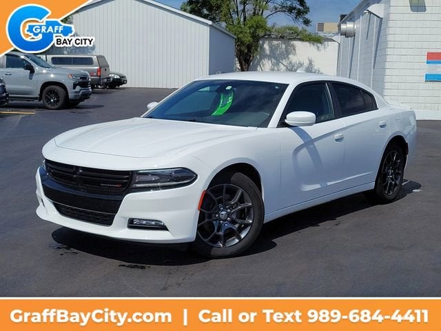 2016 Dodge Charger SXT in White — front three-quarter view
